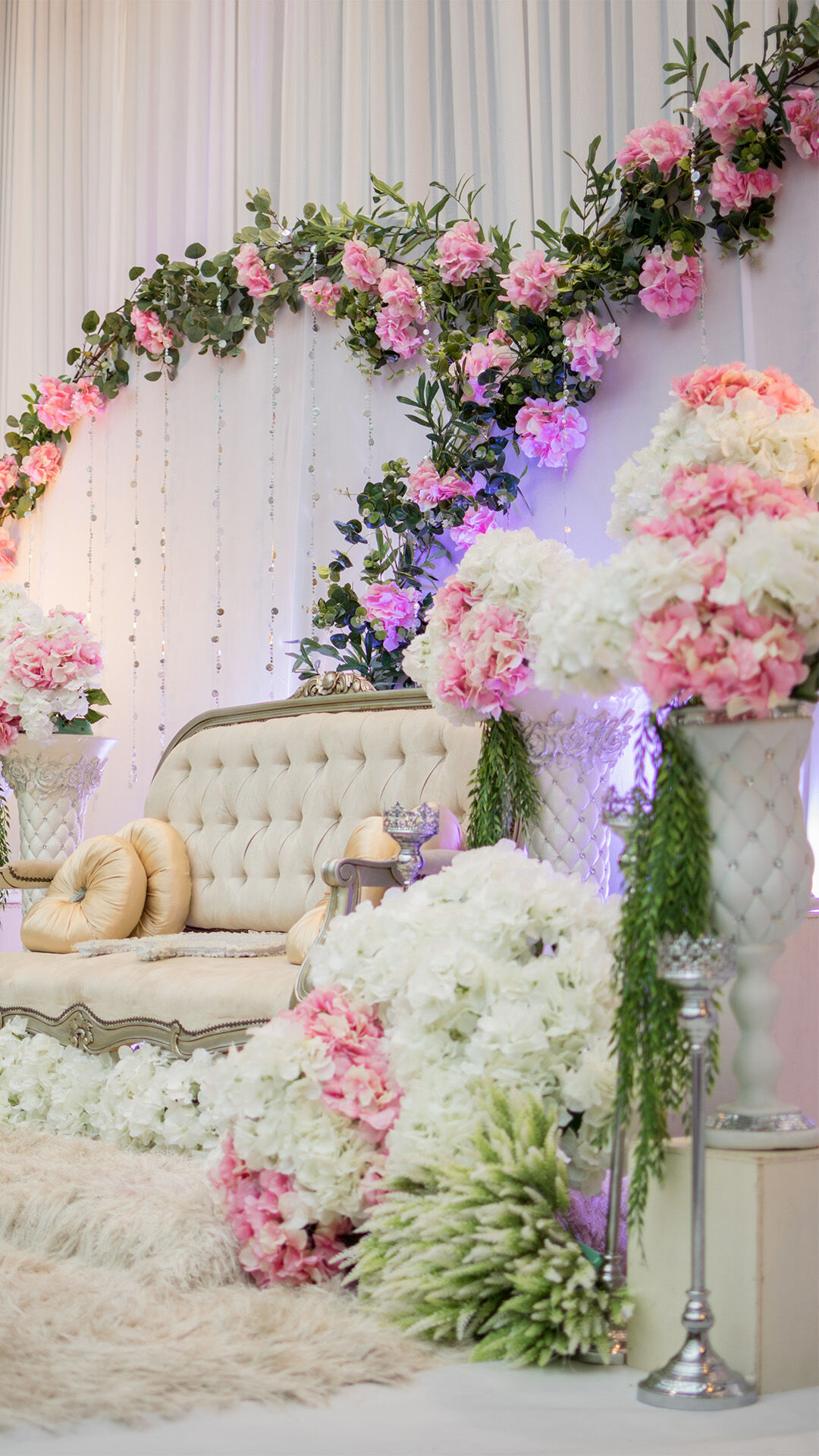 Wedding decor for Indian weddings with white flours and a beautifull sofa 